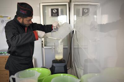 Mohammed Wishah, a 37-year-old gelato maker, pours a mixture into a blender in Gelato di Gaza‚Äôs production room. Location: Bureij refugee camp, central Gaza. 5 February 2020. Rosie Scammell  for The National