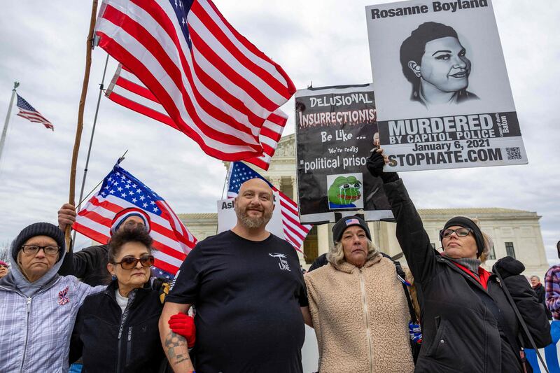 Several demonstrators gathered near the Capitol, including  Micki Witthoeft, centre, the mother of Ashli Babbitt, who was killed by police during the insurrenction. Getty / AFP