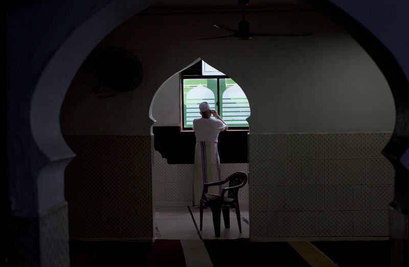 A man speaks on his mobile phone inside a mosque in Colombo, Sri Lanka. AP Photo