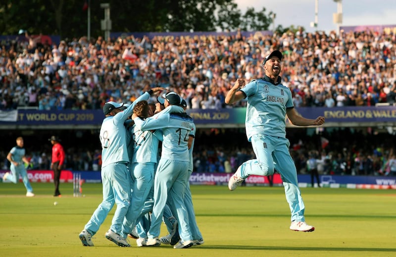 England players celebrate after winning the Cricket World Cup final at Lord's. AP