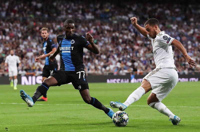 Eden Hazard of Real Madrid is challenged by Clinton Mata of Club Brugge  during the UEFA Champions League group A match between Real Madrid and Club Brugge KV at Bernabeu in Madrid, Spain. Getty Images