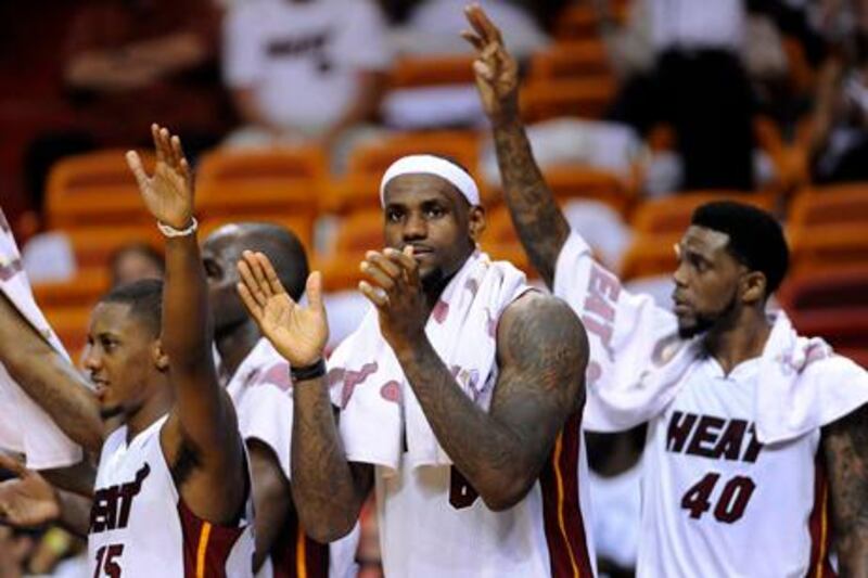 epa03230985 Miami Heat players (L-R) Mario Chalmers, Joel Anthony, LeBron James and Udonis Haslem cheer from the bench against the Indiana Pacers during the second half of game five of the Eastern Conference Semifinals at the American Airlines Arena in Miami, Florida, USA, 22 May 2012. The Heat defeated the pacers and take a three games to two lead in the best-of-seven series.  EPA/RHONA WISE CORBIS OUT