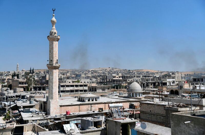 Smoke rises in the strategic town of Khan Sheikhun after government forces took control as jihadists and allied rebels withdrew from the area. All photos by SANA / AFP