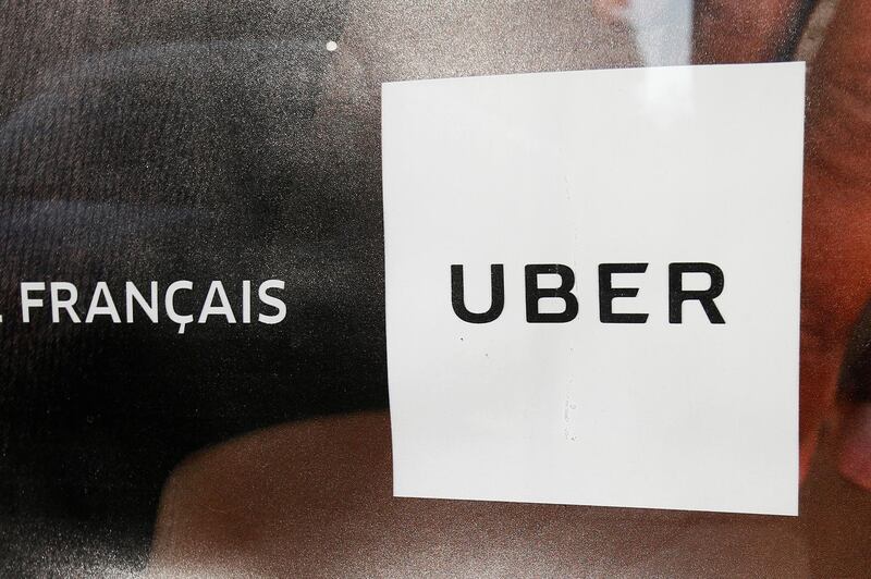 FILE PHOTO: An advertisement for the Uber car and ride-sharing service Uber is seen on a bus stop in Paris,  France, March 11, 2016.   REUTERS/Charles Platiau/File Photo