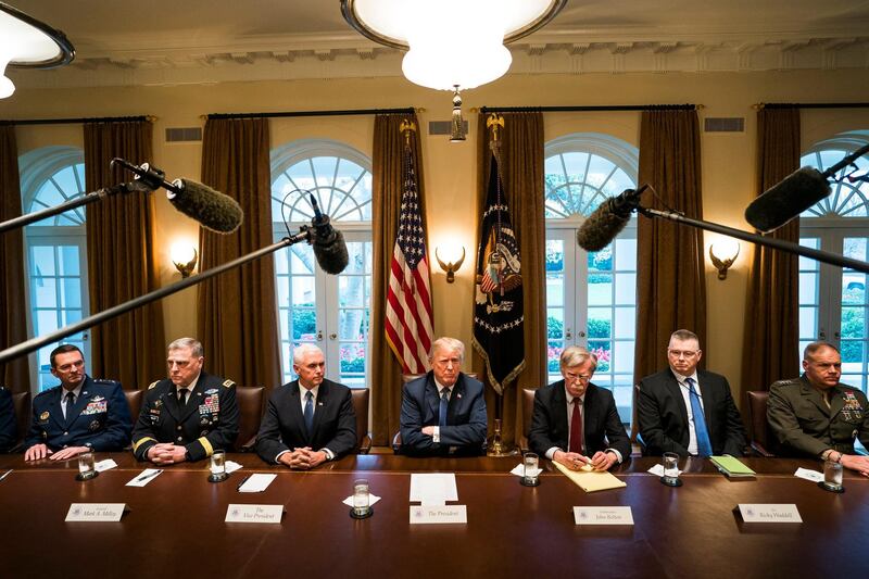 epaselect epa06658048 US President Donald J. Trump (C) speaks with the media before a meeting with his military leadership in the Cabinet Room of the White House in Washington DC, USA, 09 April 2018. Trump said he will decide in the next few days whether the US will respond militarily for the reported chemical weapons attack in Syria. Trump also spoke about the FBI raid of his personal attorney Michael Cohen's office.  EPA/JIM LO SCALZO