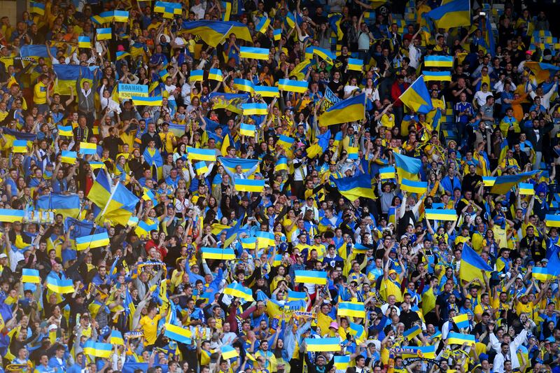 Ukraine fans celebrate after Andriy Yarmolenko's first goal. Getty