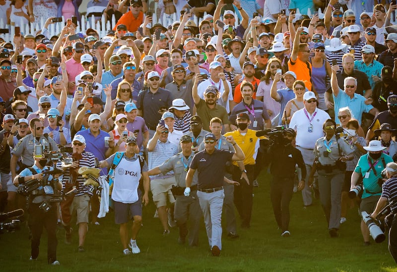 May 23, 2021; Kiawah Island, South Carolina, USA; Phil Mickelson and caddie Tim Mickelson walks though the crowd of fans on the 18th hole during the final round of the PGA Championship golf tournament. Mandatory Credit: Geoff Burke-USA TODAY Sports     TPX IMAGES OF THE DAY