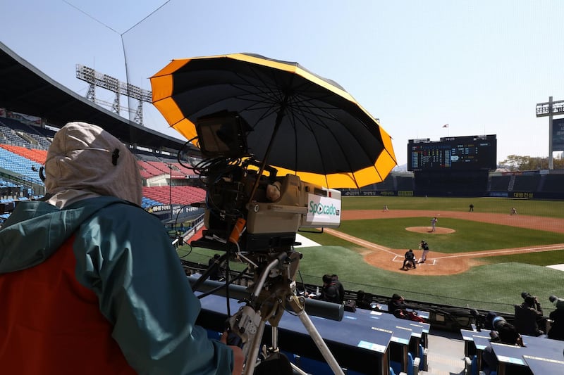 Employees of LG Twins broadcast their intra-team game played for fans at a empty Jamshil baseball stadium, as South Koreans take measures to protect themselves against the spread of coronavirus (COVID-19) in Seoul, South Korea. Getty Images