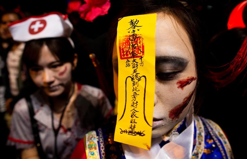 Costumed revellers attend Halloween celebrations in Lan Kwai Fong in Hong Kong, China. EPA
