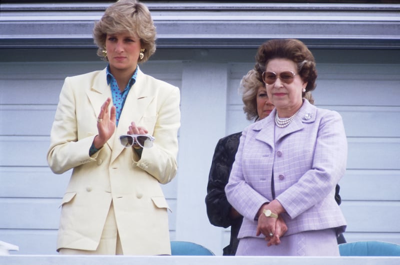 The monarch with Princess Diana in 1987. Getty