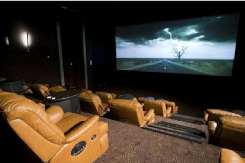 Reel Cinemas markets itself as the UAE's first business-class, boutique theatre, with tiered seating, a smaller audience and reclining chairs. Courtesy of Reel