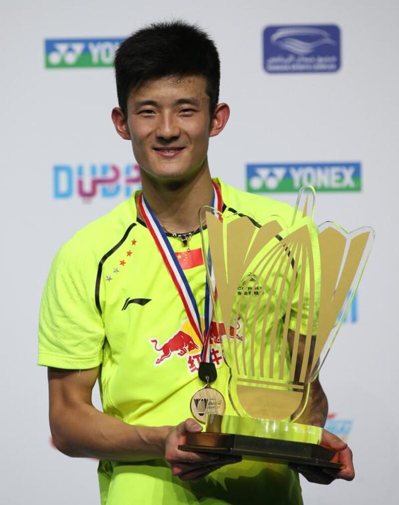 Chen Long of China celebrates with the trophy after defeating Dane Hans-Kristian Vittinghus for the men’s singles title at the BWF Destination Dubai World Superseries Finals. Ali Haider / EPA