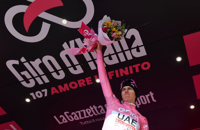 UAE Team Emirates rider Tadej Pogacar celebrates on the podium wearing the leader's pink jersey after winning Stage 8 of the Giro d'Italia from Spoleto to Prati di Tivo on Saturday, May 11, 2024. Reuters