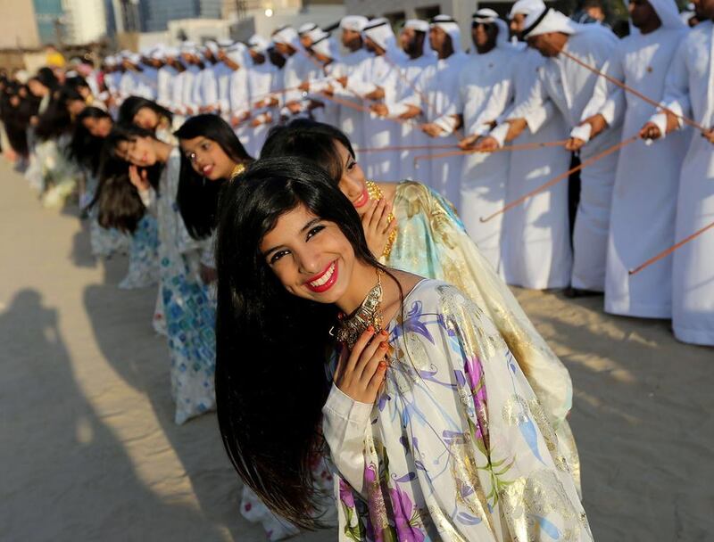 Emiratis perform a Traditional Emirati Dance during the Qasr Al Hosn festival in Abu Dhabi March 1, 2014. Sammy Dallal / The National