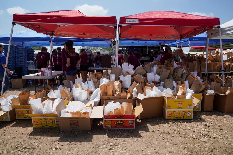 Bags with brisket sandwiches and a snack that will be sold at a fundraiser for families of the victims. Reuters 