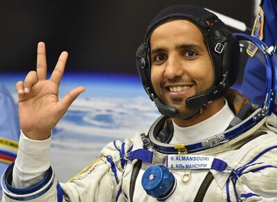 epa07868726 Member of the main crew to the International Space Station (ISS) United Arab Emirates' astronaut Hazza Al Mansouri waves before boarding a Soyuz rocket to the International Space Station (ISS) at the Russian-leased Baikonur cosmodrome in Kazakhstan, 25 September 2019. Mansouri will be the first Emirati in space.  EPA/VYACHESLAV OSELEDKO / POOL