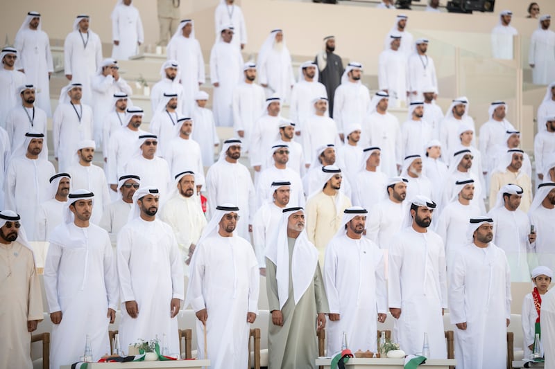 Sheikh Zayed bin Saif; Sheikh Nahyan bin Mubarak, Minister of State for Tolerance; and Sheikh Mohamed bin Nahyan stand for the national anthem with other dignitaries. Abdullah Al Junaibi for the Presidential Court