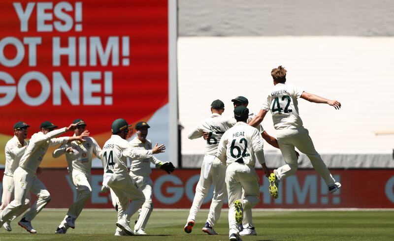 Australia's Cameron Green celebrates the wicket of England's James Anderson to claim The Ashes during day three of the third Test at the Melbourne Cricket Ground. PA
