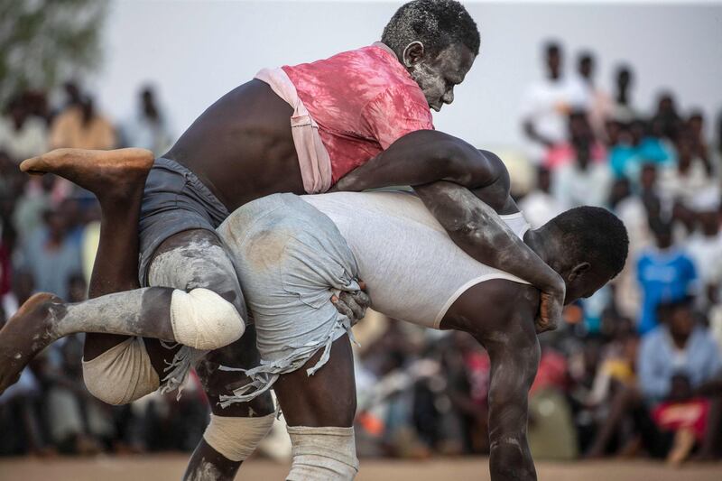 Wrestlers compete during a traditional Nuba wrestling competition in Sudan's capital Khartoum.