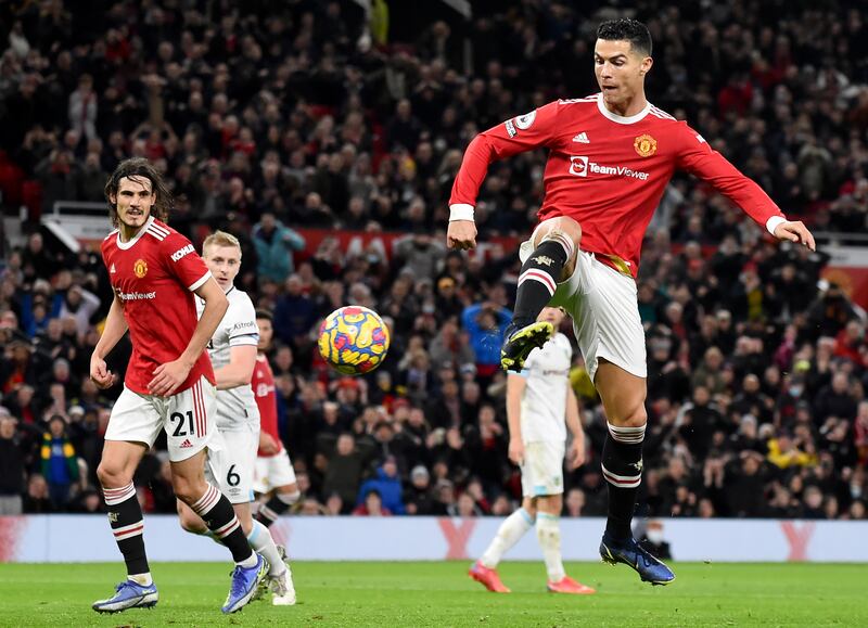 Manchester United's Cristiano Ronaldo scores in the Premier League match against Burnley at Old Trafford in December 2021. EPA