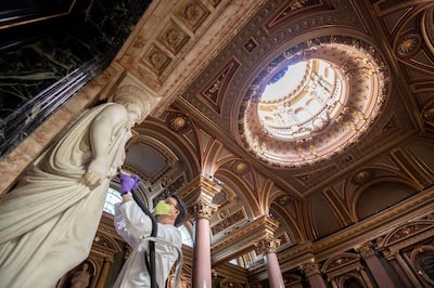 Conservator Edward Cheese cleans marble sculptures at the Fitzwilliam Museum in Cambridge as they make final preparations to reopen to the general public following the easing of lockdown restrictions in England. (Photo by Joe Giddens/PA Images via Getty Images)