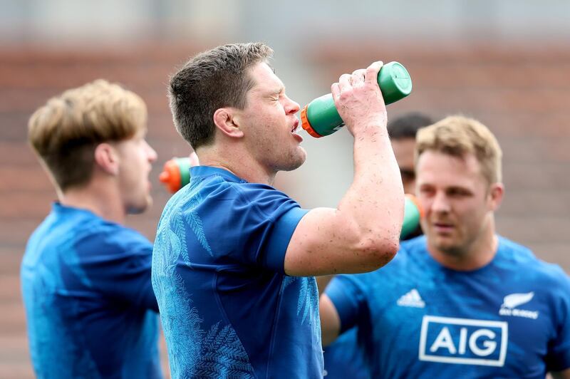 Scott Barrett gets some much-needed fluids down during All Blacks' training in Japan. Getty