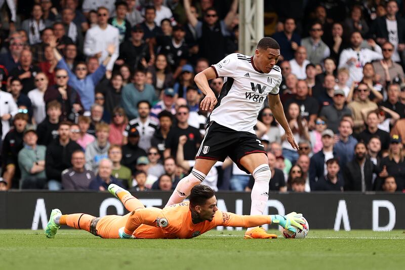 Manchester City goalkeeper Ederson saves at the feet of Fulham's Carlos Vinicius. Getty