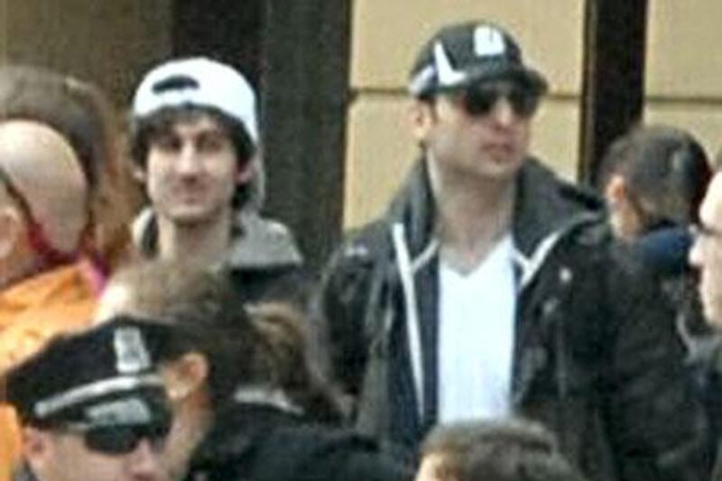 The suspect in the white cap has been named as Dzhokar Tsarnaev, according to reports. The other suspect, Dzhokar Tsarnaev's brother, in the Boston Marathon bombings has been killed.