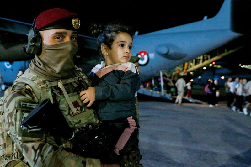 This child was one of those to have arrived safely in Amman. AFP