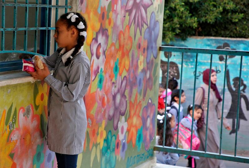 Children return to school. AFP