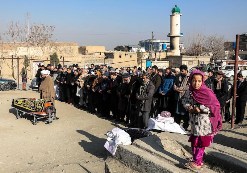 People attend the funeral ceremony of an Afghan female judge in Kabul, Afghanistan. EPA