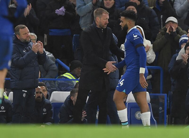 Reece James is comforted by manager Graham Potter after he was injured. EPA