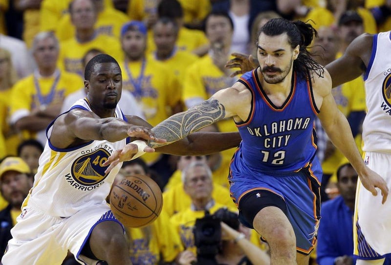 Oklahoma City Thunder's Steven Adams, right, fights for a loose ball against Golden State Warriors' Harrison Barnes during the second half in Game 1 of the NBA basketball Western Conference finals Monday, May 16, 2016, in Oakland, Calif. Oklahoma City won 108-102. (AP Photo/Marcio Jose Sanchez)