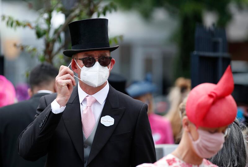 Racegoers are seen in protective masks at Royal Ascot. Reuters