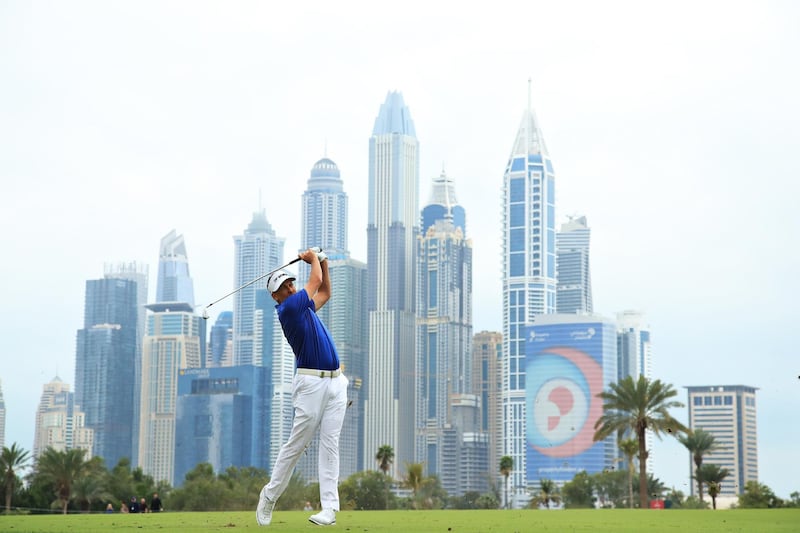 Ian Poulter of England plays his second shot on the 13th hole. Getty Images