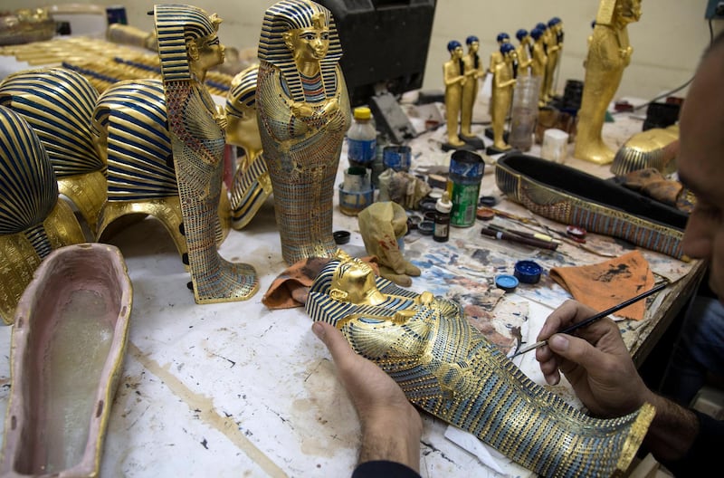 An artist works on a Pharaonic statue at the Replica Production Unit located at Salah Al Din Citadel in Cairo, Egypt. EPA