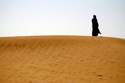 A woman stands in the Sahara, which was once green. Photo: Flickr