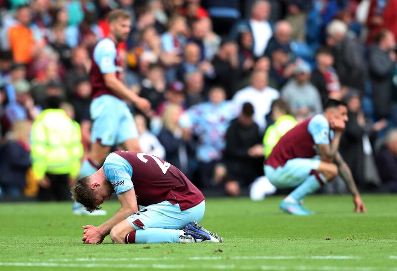 Soccer Football - Premier League - Burnley v Newcastle United - Turf Moor, Burnley, Britain - May 22, 2022 Burnley's Nathan Collins looks dejected after losing the match and being relegated from the Premier League REUTERS/Scott Heppell EDITORIAL USE ONLY.  No use with unauthorized audio, video, data, fixture lists, club/league logos or 'live' services.  Online in-match use limited to 75 images, no video emulation.  No use in betting, games or single club /league/player publications.   Please contact your account representative for further details. 