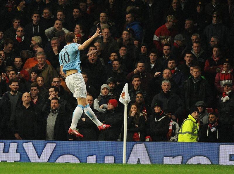 Edin Dzeko celebrates after scoring for Manchester City on Tuesday night. Peter Powell / EPA / March 25, 2014