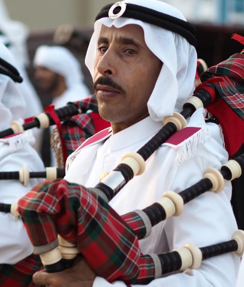 A member of the Abu Dhabi Police band plays the bagpipes.