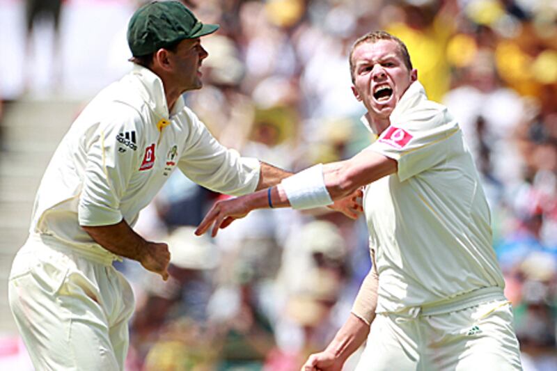 Ricky Ponting, Australia's captain, tries to restrain Peter Siddle after the dismissal of England's Matt Prior in Perth.