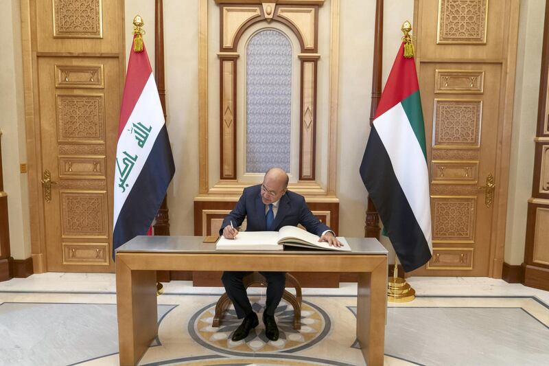 ABU DHABI, UNITED ARAB EMIRATES -November 12, 2018: HE Dr Barham Salih, President of Iraq (C), signs a guest book during a reception at the Presidential Palace.

(Rashed Al Mansoori / Crown Prince Court - Abu Dhabi )
---