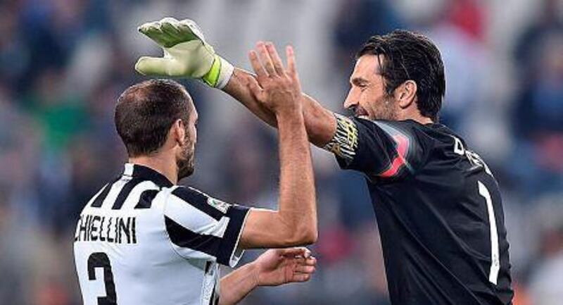 Juventus defender Giorgio Chiellini, left, celebrates with his teammate Gianluigi Buffon at the of the Italian Serie A soccer match between Juventus and Cesena at Juventus Stadium in Turin, Italy, 24 September 2014. EPA/ALESSANDRO DI MARCO