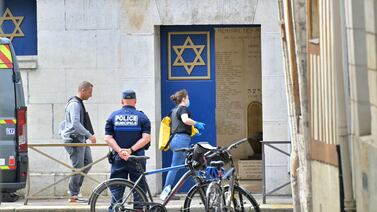 Police officers investigate at a synagogue in the Normandy city of Rouen where French police have killed earlier an armed man who was trying to set fire to the building. AFP