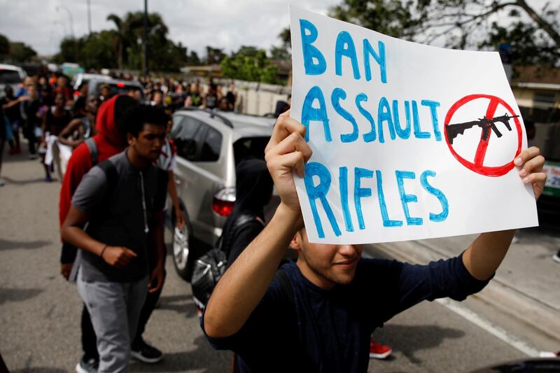 FILE PHOTO: Students from South Plantation High School carrying placards and shouting slogans walk on the street during a protest in support of the gun control, following a mass shooting at Marjory Stoneman Douglas High School, in Plantation, Florida, February 21, 2018. REUTERS/Carlos Garcia Rawlins/File Photo