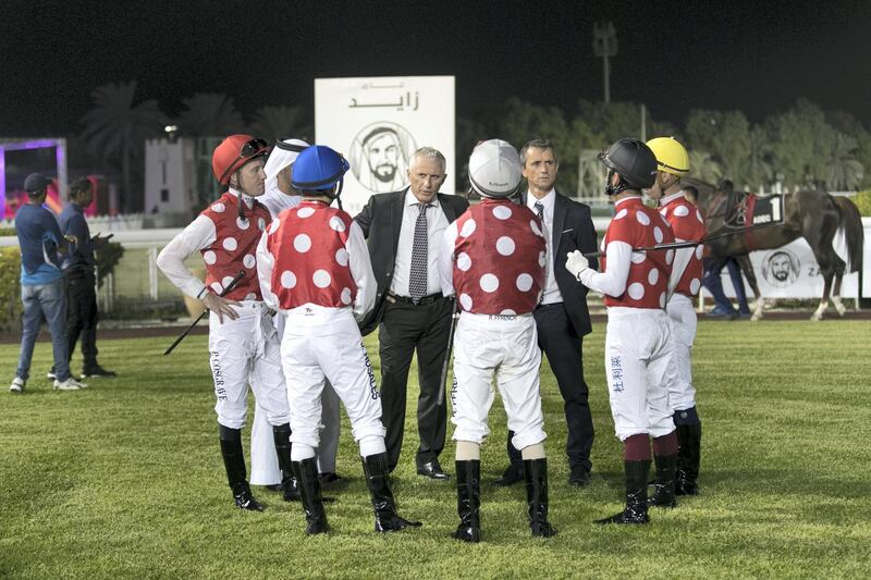 ABU DHABI, UNITED ARAB EMIRATES - NOVEMBER 3, 2018. 

Al Asayl trainer Eric Lemartinel, left, talks to the jockeys at Abu Dhabi Equestrian Club.

(Photo by Reem Mohammed/The National)

Reporter:
Section:  SP