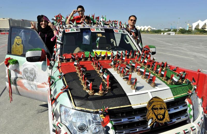 Readers say this National Day is special as it coincides with Dubai’s win in its Expo 2020 bid. Above, contestants for the Guinness World Records title in the decorated cars category at in Abu Dhabi yesterday. Charles Crowell for The National

