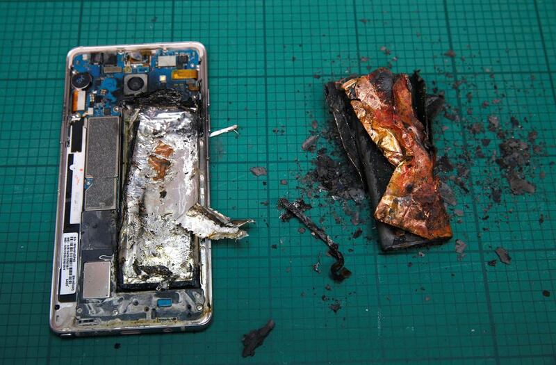 A Samsung Note 7 handset next to its charred battery after tests. Edgar Su / Reuters