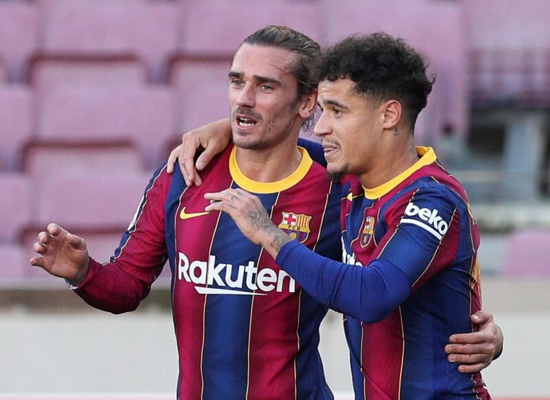 Barcelona's Philippe Coutinho celebrates scoring their third goal with Antoine Griezmann. Reuters