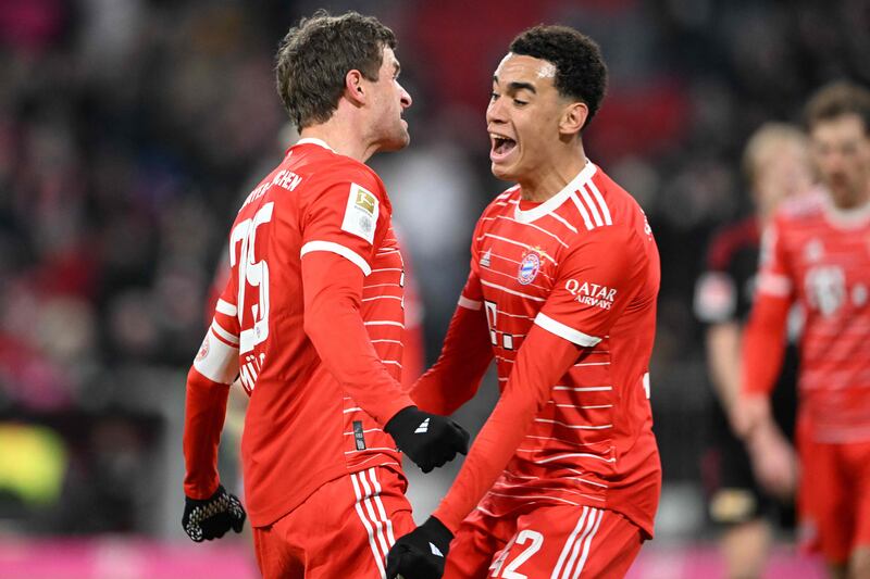 Bayern Munich midfielder Jamal Musiala, right, celebrates scoring their third goal. AFP